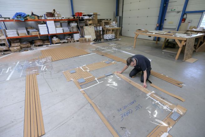 Workshop preparation of a Flexiteek synthetic teak deck