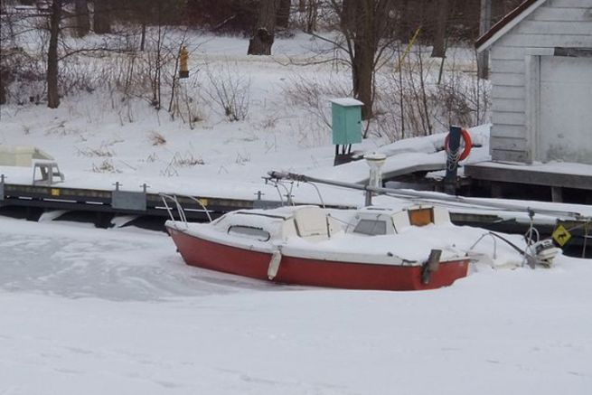 Sailing boat under the snow