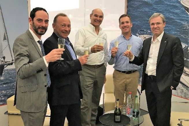 Bnteau Group, Jeanneau and Freedom Boat Club executives celebrate their agreement
