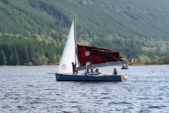 Multimono lowering his mainsail