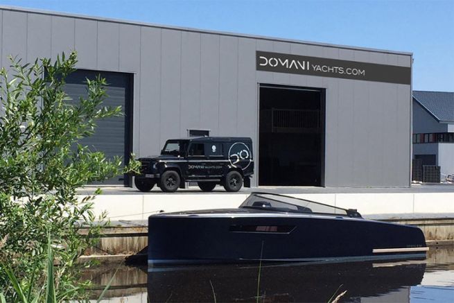 Motorboat Domani E32 from Domani Yachts in front of the new factory in Drachten