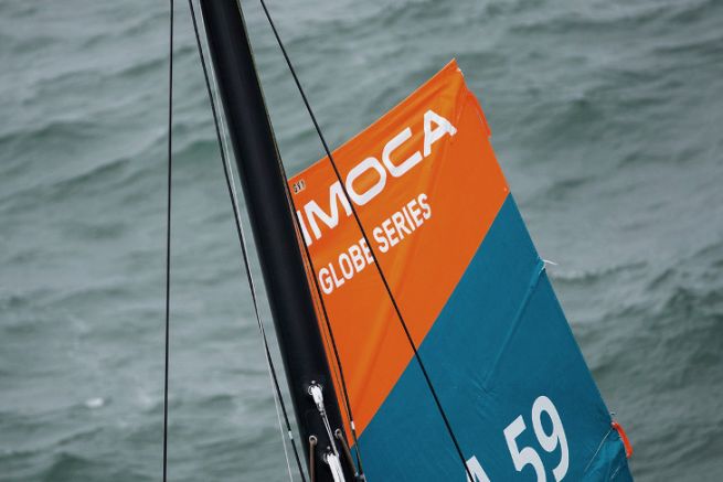 The IMOCA logo imagined by Be-Poles, at the head of a mainsail with reefing