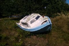 Wreck of a pleasure boat in composite